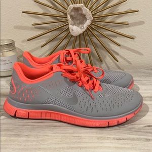Grey and hot pink Nike Free Runs